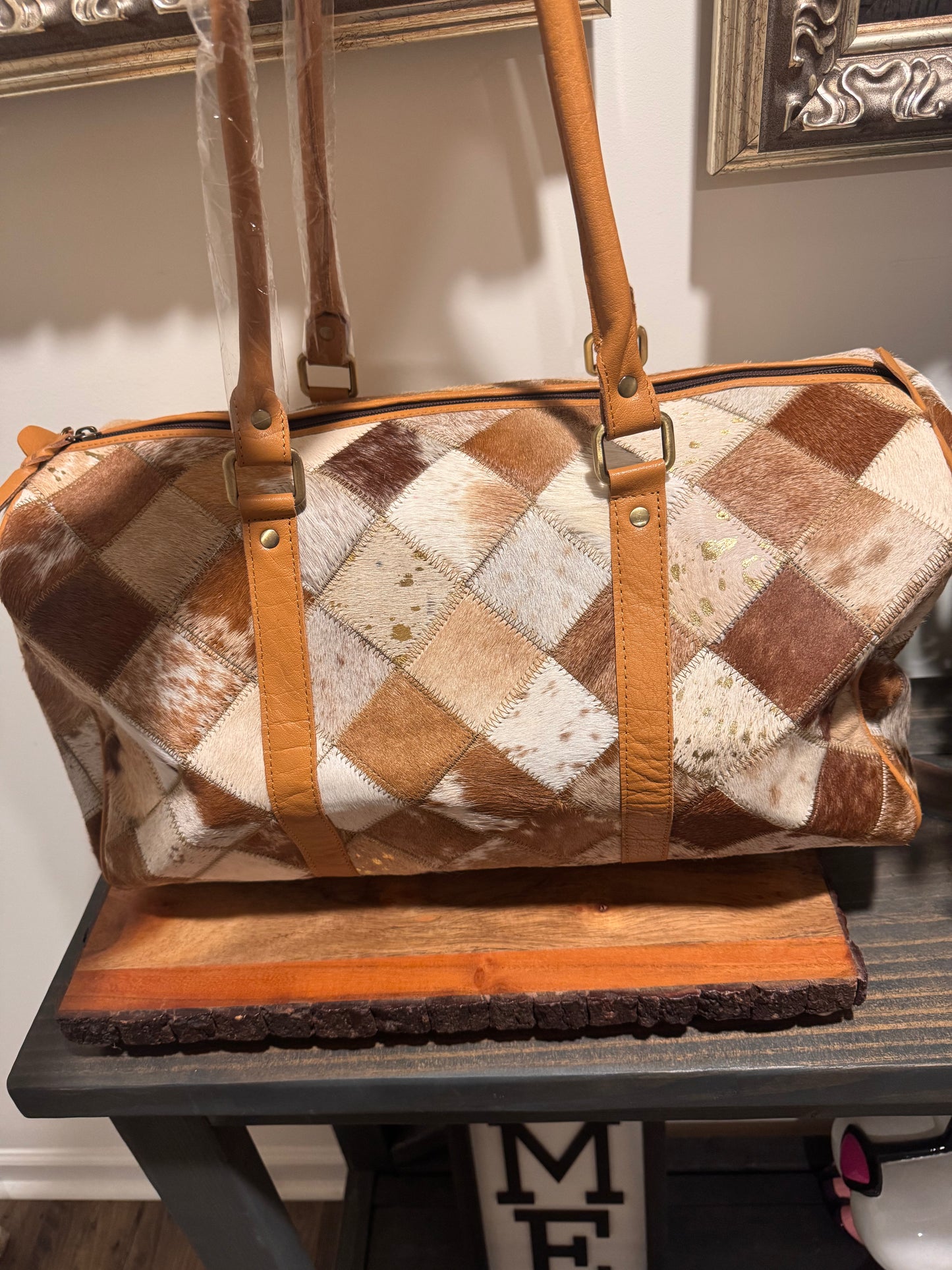 Patch work cowhide duffle bag