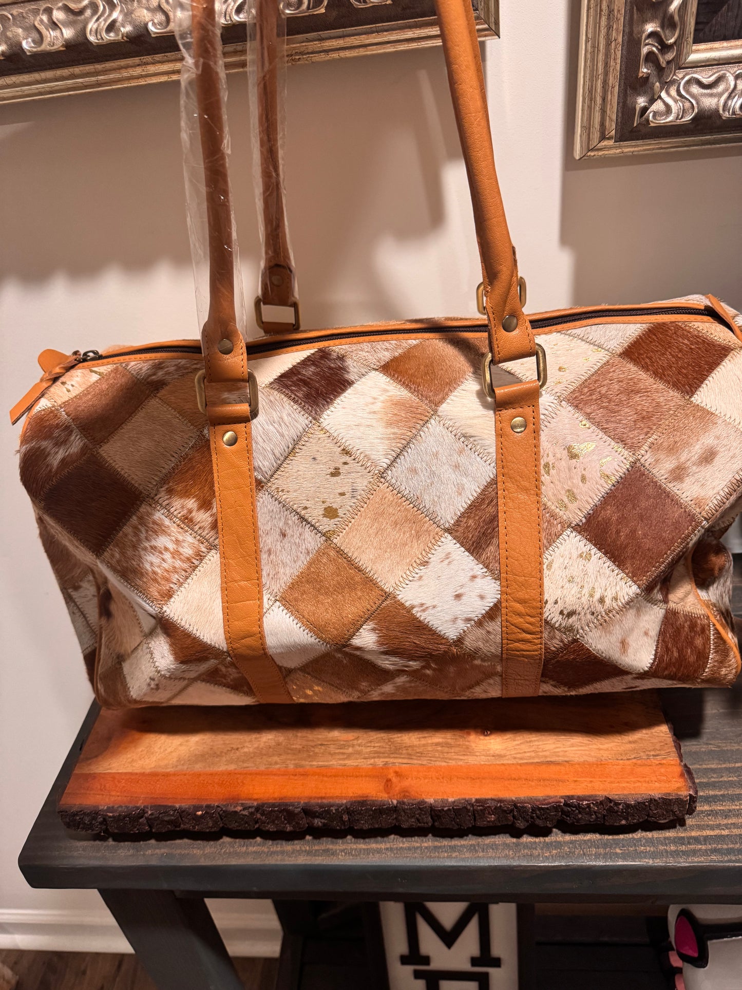 Patch work cowhide duffle bag