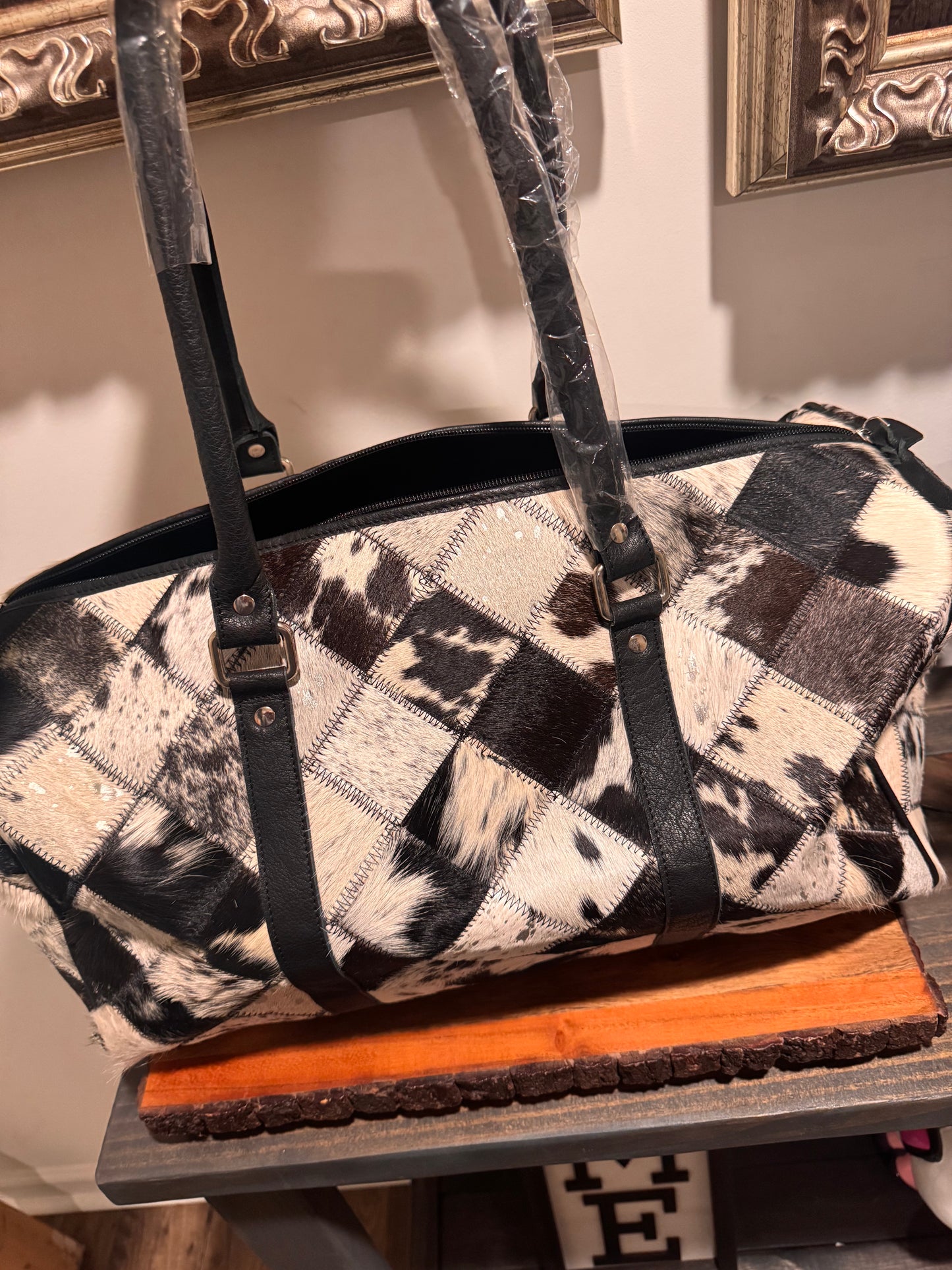 Patch work cowhide duffle